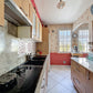 Cuisine aménagée avec espace repas  maison familiale Le Coudray 28630